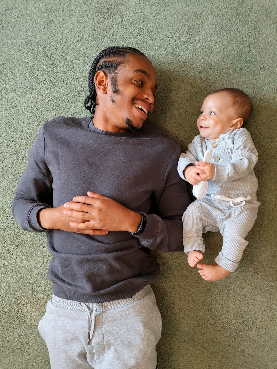 Photo by OPPO Find X5 Pro a person holding a baby